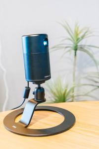 a camera on a stand on a table at Otter Stay Lite - Shinsakae in Nagoya +72 photos