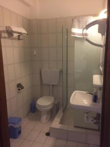 a bathroom with a toilet and a sink at Fotini's Beach in Olympic Beach +43 photos