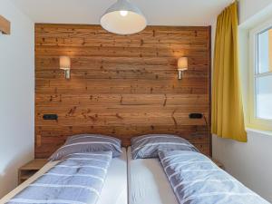 Ένα ή περισσότερα κρεβάτια σε δωμάτιο στο Modern Apartment near Ski Area in Brixen im Thale