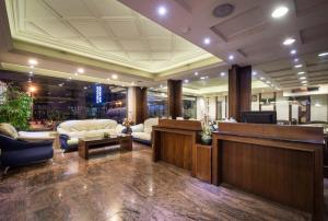 a lobby with a waiting room with a reception desk at The Enterpriser Hotel in Taichung