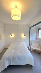 Ένα ή περισσότερα κρεβάτια σε δωμάτιο στο Studio Lumineux 1pers