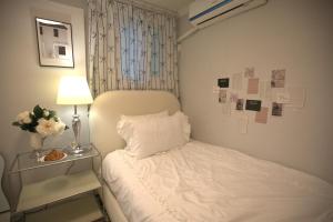 Postel nebo postele na pokoji v ubytování stay sosom#cozy house#Daegu#coveninent traffic