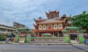 a large building with a building at The Bed Hotel Hatyai in Hat Yai