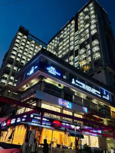 a building with a sign on the front of it at Heavenly stays in Greater Noida