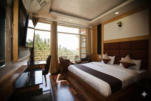 a bedroom with a large bed and a large window at Verma Homestay in Shimla