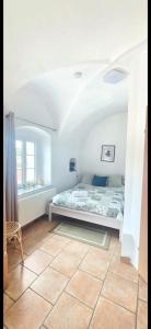 Cama ou camas em um quarto em City Rooms Steyr