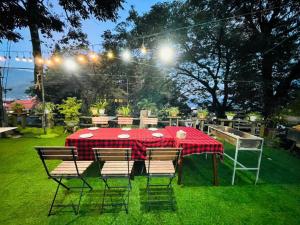a table with chairs and a red table cloth at Sapa Hidden Gem Hotel & Spa in Sa Pa +116 photos