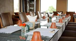a row of tables with orange cones on them at Hananoie - A Permaculture Resort in Astam