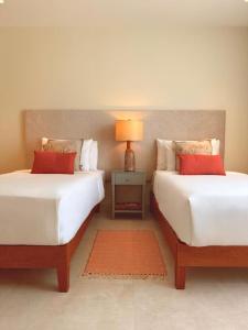 Ένα ή περισσότερα κρεβάτια σε δωμάτιο στο Bocobay Costa Catalina