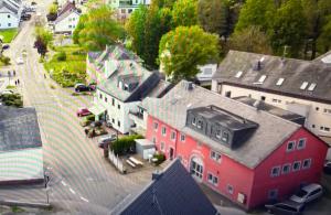 an aerial view of a town with a red house at Gästehaus Back - Reisfelder Hof in Reinsfeld
