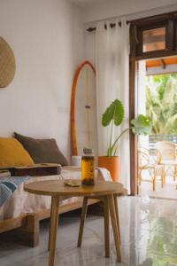 a living room with a table with a candle on it at Kelani Retreat in Matara