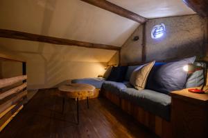 a small room with a bed and a table at cofunia in Tenri