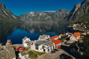an aerial view of a town on a lake with mountains at Wangen Apartments in Aurland