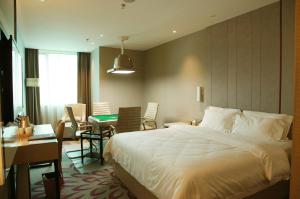 Ένα ή περισσότερα κρεβάτια σε δωμάτιο στο Lavande Hotel Changsha Dong Tang