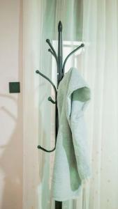 a towel hanging on a towel rack in a bathroom at Kigali Airport Stay Apartments in Kigali +74 photos