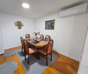 a dining room with a table and chairs at Apartman SAN in Sarajevo