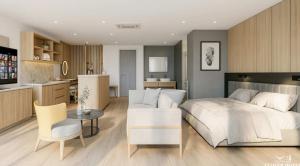 清迈The Clover的一间带一张白色大床的卧室和一间厨房