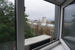a view of a city from a window at Студія в 5 хв від залізничного вокзалу in Kharkiv