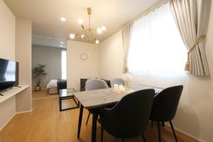 TV a/nebo společenská místnost v ubytování インテグラル大手町 203