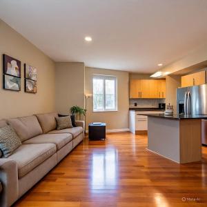 a living room with a couch and a kitchen at Seiraa Apart in Batam Center