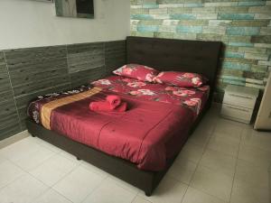 Ένα ή περισσότερα κρεβάτια σε δωμάτιο στο sunset homestay marina island