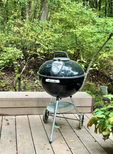 a grill sitting on top of a wooden table at Foresta Karuizawa 6 "Glamping & Tent" for 8 people in Karuizawa