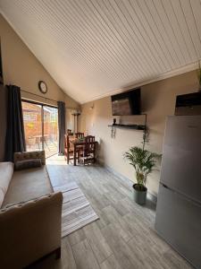 a living room with a couch and a table at Leanie's Place in Clarens
