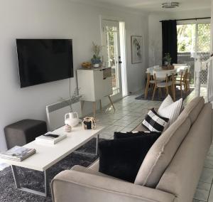 a living room with a couch and a table at Lakeview Home in Toronto