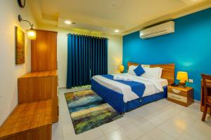 Ένα ή περισσότερα κρεβάτια σε δωμάτιο στο Manaf Hotel Suites