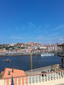 a view of a river with boats in a city at Douro Vila 10 - Best View in Town in Bandeira +2 photos