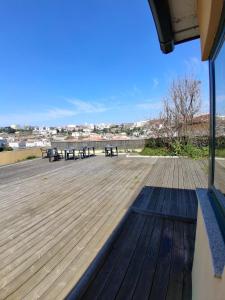 a large deck with benches and tables on it at Douro Vila 10 - Best View in Town in Bandeira