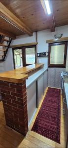 a kitchen with a counter and a red rug at Dream weekend house in Visoko +34 photos