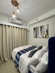 a hotel room with two beds and a window at Blisshaven SHORE 2 B03-14100 in Sampong