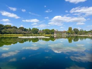 a lake with trees and clouds in the sky at #39 Ukimafunado in Tokyo