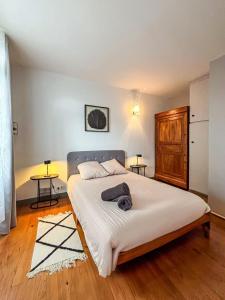 Ένα ή περισσότερα κρεβάτια σε δωμάτιο στο Le Voilier