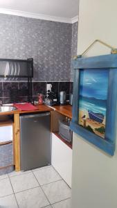 a kitchen with a fish tank on the wall at 2 Bed, King XL Bed, Dining&Office Space in Heathfield