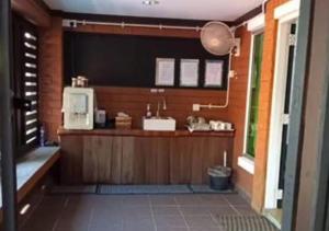a kitchen with a counter in a room at Villa Ilham in Langkawi Intl