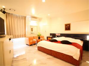 Postel nebo postele na pokoji v ubytování ホテル 白雪姫 -水島インターチェンジ隣-