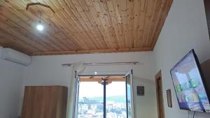 TV a/nebo společenská místnost v ubytování Dino Guest House