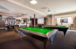 a billiard room with a pool table in it at Granville Hotel in Sydney