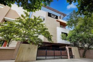 a building with a sign on the side of it at Hotel O Ashok Nagar Metro Station Chennai Formerly G Cloud in Chennai +35 photos