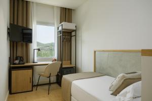 Postel nebo postele na pokoji v ubytování Hotel Costabella + 82 fotografií