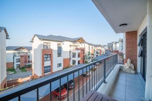 an apartment balcony with a view of a street at 366 Ballito Hills in Ballito