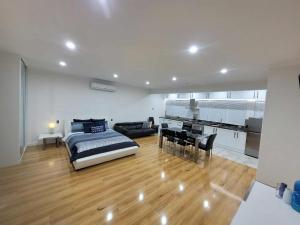 a bedroom with a bed and a desk in a room at Luxury Resort Studio Apartment Retreat with Pool, Tennis & Alfresco  +34 photos