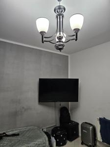 Μια τηλεόραση ή/και κέντρο ψυχαγωγίας στο Appartement proche de la mer