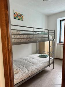 Postel nebo postele na pokoji v ubytování La casetta sul colle di Selvino