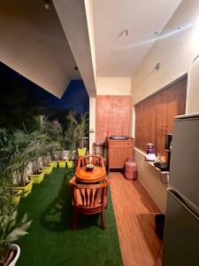a kitchen with a table and chairs in a room at The Mysterious Heaven Kashi in Varanasi