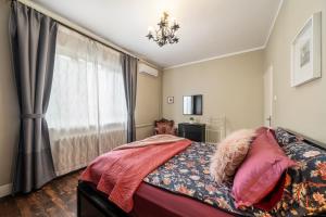 a bedroom with a bed and a window at Top Center 2 Aptartments - Gurko Str in Sofia +25 photos