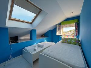 Ένα ή περισσότερα κρεβάτια σε δωμάτιο στο Apartamento con vistas al mar en la playa de Somo