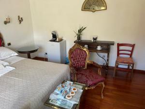 a bedroom with a bed and a table and chairs at La Casa di Dante Fiesole in Trespiano